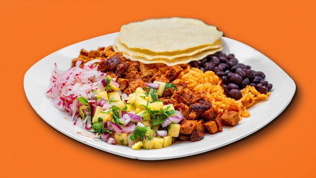 Taco Plate · Three fresh handmade corn tortillas, rice, beans, onions, cilantro, and radish.