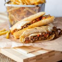 Cheese Steak Sandwich · Herb-Marinated Beef, Peppers, Onions, American Cheese