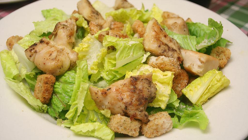Caesar Salad With Grilled Chicken · Romaine lettuce, croutons, and Parmesan  cheese and grilled chicken.