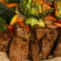 Steak Tips Dinner · 10oz marinate steak tips (flak steak) cooked on grilled and served with choice of side