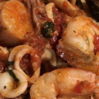 Linguine Frutti Di Mare · Shrimp calamari, scallops, and mussels in a light plum tomato sauce.