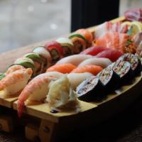 W263. Family Platter For 2 · 2 chef's  special rolls, 10 pieces sushi and 12 pieces sashimi. Served with choice of side.