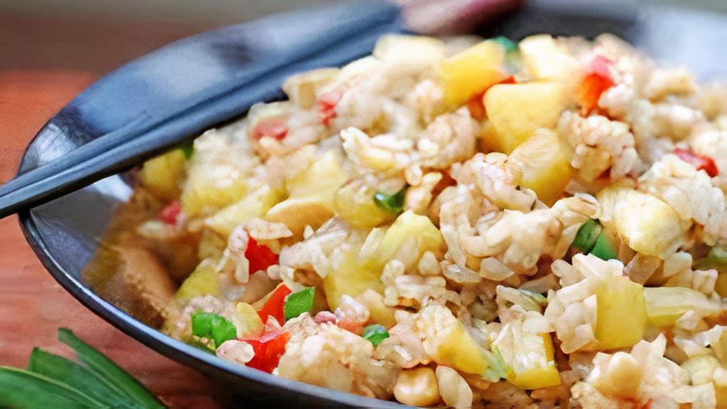 Pineapple Fried Rice · Curry powder, bell pepper, onion, peas and carrot.