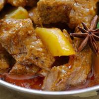 Massaman Curry (L) · Potatoes, onion, carrot, yellow squash, tomatoes, peanut.