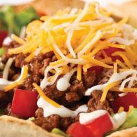 Taco Salad · Comes in a baked flour tortilla or with chips. Included are lettuce, cheese, tomatoes, sour ...