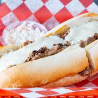 Pulled Pork Cheese Steak · Smoked pulled pork smothered in our house cheese sauce, served on an Italian long roll.