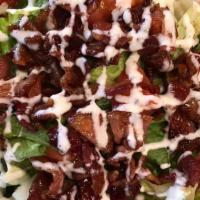Blt Salad · Romaine lettuce topped with crispy candied bacon, tomato, and shaved parmesan cheese.