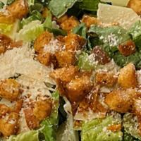Caesar Salad · Romaine lettuce topped with croutons and shaved parmesan cheese.