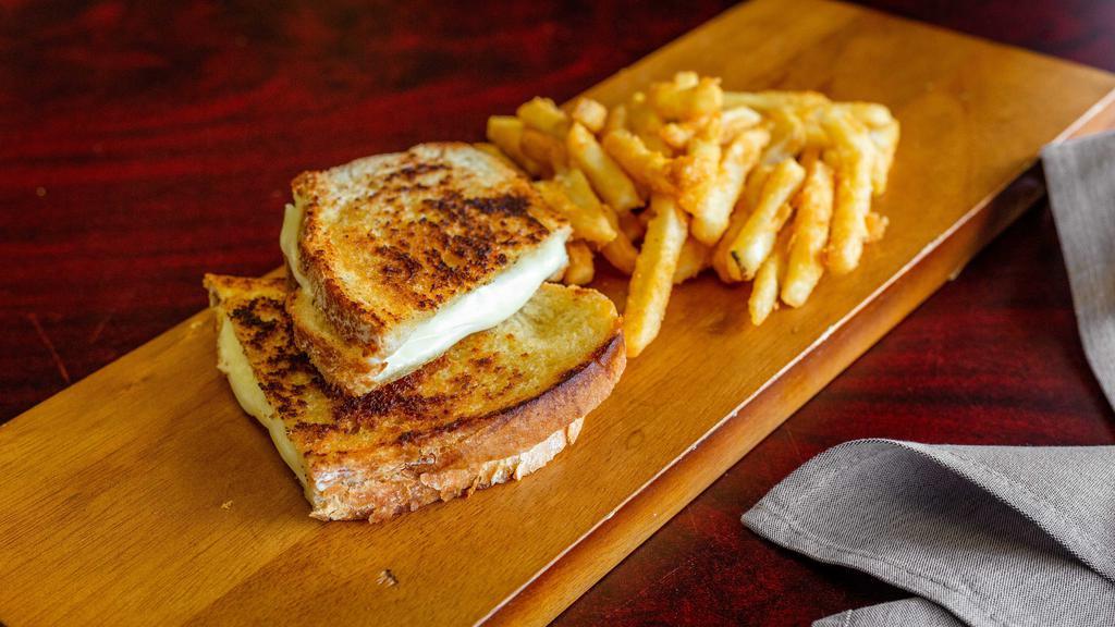 Grilled Cheese  · Grilled white bread and American cheese melted 
Served w/ French fríes