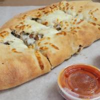 Sm Steak Combo Calzone · Shaved steak, onions, peppers, mushrooms with marinara sauce on the side.