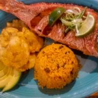 Pargo Frito Entero · Deep fried whole red snapper with your choice of two sides