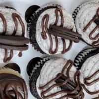 Cookies & Cream · Chocolate cake filled with Oreo cream, topped with Oreo cookie and
chocolate drizzle.