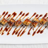 Dragon Roll · Crab, avocado, cucumber, topped with eel and eel sauce.