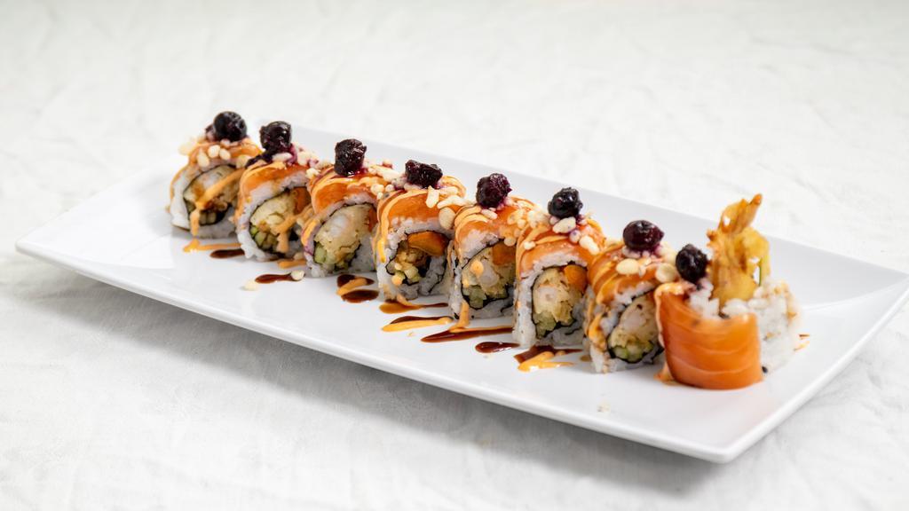 Honey Roll · Spicy. Shrimp tempura, sweet potato tempura, cucumber, eel sauce, topped with sliced salmon, spicy mayo and blueberry sauce.