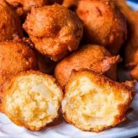 Hushpuppies  · small, savory, deep-fried round ball made from cornmeal-based batter.