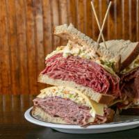 Corned Beef & Pastrami Triple · With swiss, cole slaw and russian dressing.