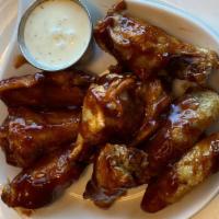 Boneless Chicken Wings · Crispy tenders tossed in your preference of our house-made buffalo or BBQ and a side of bleu...