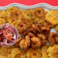 Camarones Apanados · Arroz blanco, camarones apanados y patacones
Rice, fried shrimp, and fried green plantains