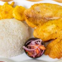 Filete De Pescado · Filete de tilapia frito con arroz, y papas fritas o patacones
Fried tilapia, white rice and ...