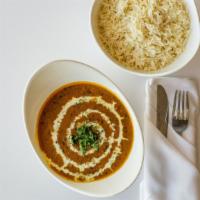 Daal Makhni · Lentils sauteed in butter with fresh herbs and spices, garnished with fresh coriander.