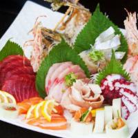 Sashimi Deluxe (12 Pieces) · Chef's choice of assorted filets of raw fish and rice.