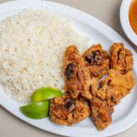 Pollo Frito Con Arroz · Fried chicken with rice or fried  plantains.
