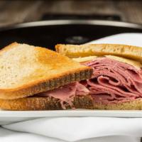 Grilled Reuben Sandwich · Served on rye toast with Russian dressing, sauerkraut and Swiss cheese.