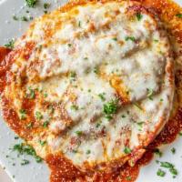 Lasagna · Layers of noodles, cheese and ground beef, oven baked and topped with tomato sauce and mozza...