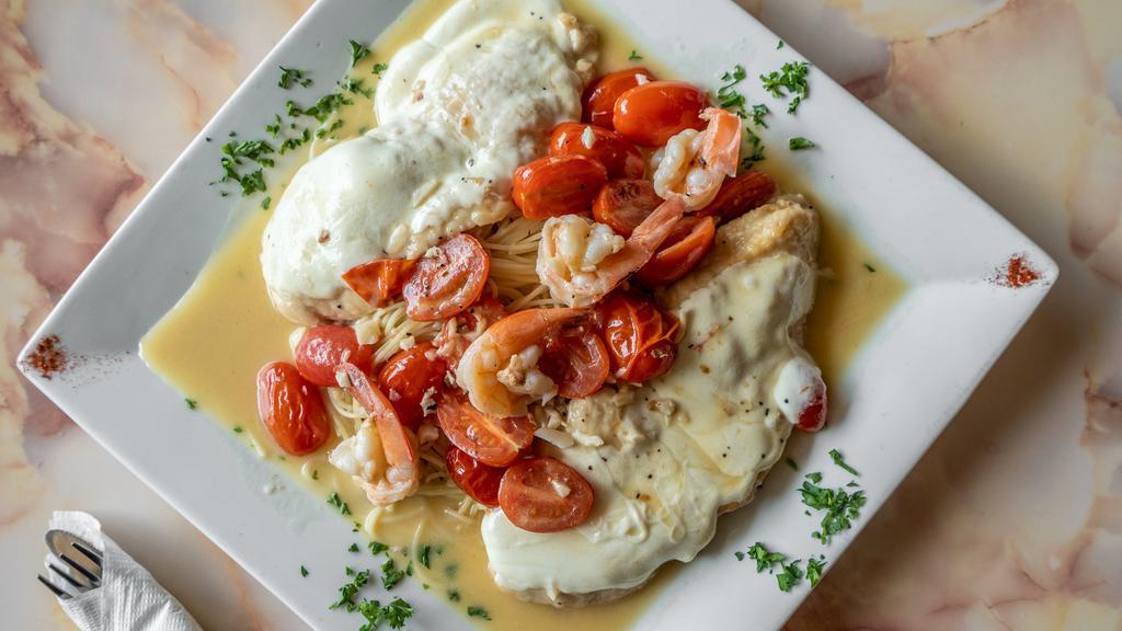 Chicken And Shrimp Sofia · Sautéed chicken breast with shrimp in garlic and olive oil with chopped tomatoes in white wine sauce. Topped with fresh mozzarella. Served over pasta with salad and garlic knots.
