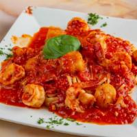 Shrimp Scampi · Served over linguine sautéed with garlic white wine sauce. Served over pasta with salad and ...