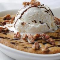 Skillet Chocolate Chip Cookie · vanilla bean ice cream, chocolate and caramel sauces, glazed pecans
