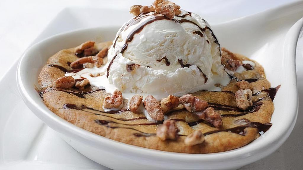 Skillet Chocolate Chip Cookie · vanilla bean ice cream, chocolate and caramel sauces, glazed pecans