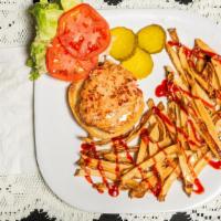Chicken Burger · Fresh Chicken Breast Chopped and Seasoned to perfection. Served with Lettuce Tomato and a si...