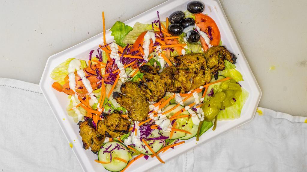 Lamb Kabob Salad · Comes with lettuce, tomato, and cucumber along with special white sauce dressing. Salads include bread and chick peas.