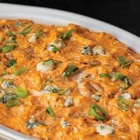 Buffalo Chicken Dip · Buffalo chicken dip is a sinfully creamy and mouthwatering
Serve hot with celery sticks & na...