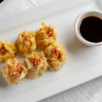 Thai Dumplings · Crispy dumplings filled with ground pork, bamboo shoots and served with soy sauce.