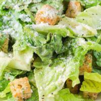 Caesar Salad · Traditional Caesar dressing, garlic croutons, and shaved Parmesan.