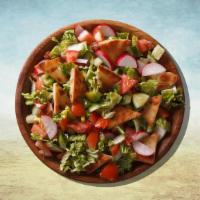 Fattoush Salad · Cucumber salad w/pita chips. It comes with pita bread, side of tahini sauce and hot sauce.
