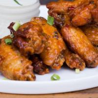 6 Wings · 6 calabrian chili wings, topped with green onions, served with gorgonzola sauce on the side