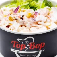 Dynamite Bop · Shrimp, crabmeat, scallop, corn, and red onion, (pre-marinated) above Lettuce and Rice. Defa...