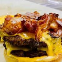 Double Bacon Cheeseburger · Two fold the tastiness. Make room for our Bacon Double Cheeseburger, two beef patties topped...