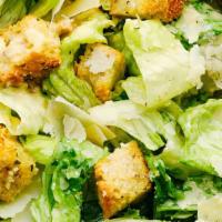 Caesar Salad · Fresh cut romaine lettuce, croutons, grated parmesan cheese, and and a homemade garlic roll