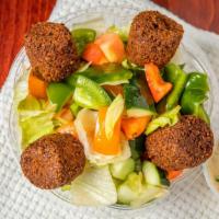 Falafel Salad · Lettuce, chopped tomatoes, cucumbers, green peppers, onion and falafel with our special dres...