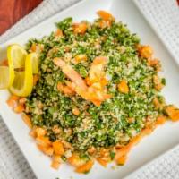 Tabbouleh · Freshly chopped tomatoes, cucumbers, parsley and bulgur. Mixed in lemon and pomegranate syru...