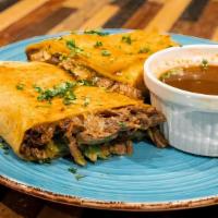 Birria Burrito · Flour Tortilla filled with shredded Beef, Spanish Rice, Black Beans, Onion, and Cilantro. Se...