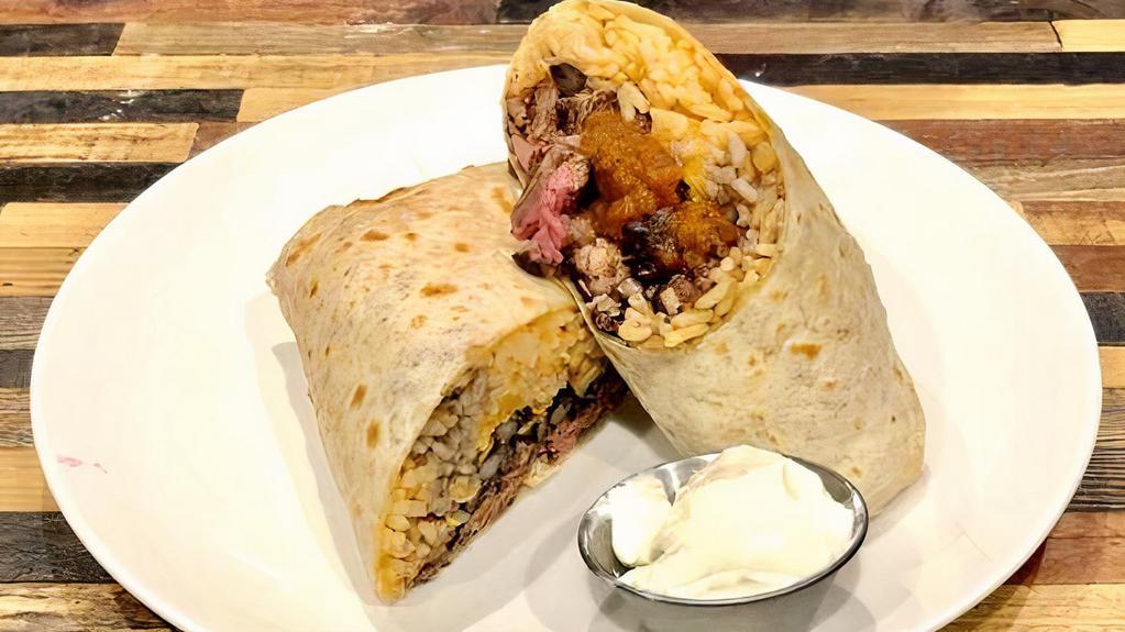 Burrito · Flour Tortilla filled with Spanish Rice, Black Beans, Cheese, Salsa, Sour Cream, and Your Choice of Protein.