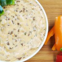 Philly Cheesesteak Dip · Philly steak, green peppers, onions and a three-cheese blend takes the Philly cheesesteak fr...