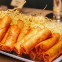 Chả Giò / Crispy Seafood Egg Rolls · Crispy egg rolls with pork meat, shrimp, carrots and taro served with house special sauce.