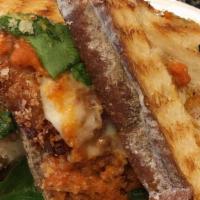 Chicken Parm Panini · Panko-breaded chicken breast, fresh tomato sauce, roasted red peppers, and mozzarella.