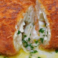 Cotelette De Volaill (Chicken Kiev) · Crispy chicken cutlet, filled with herbs and garlic butter sauce.
